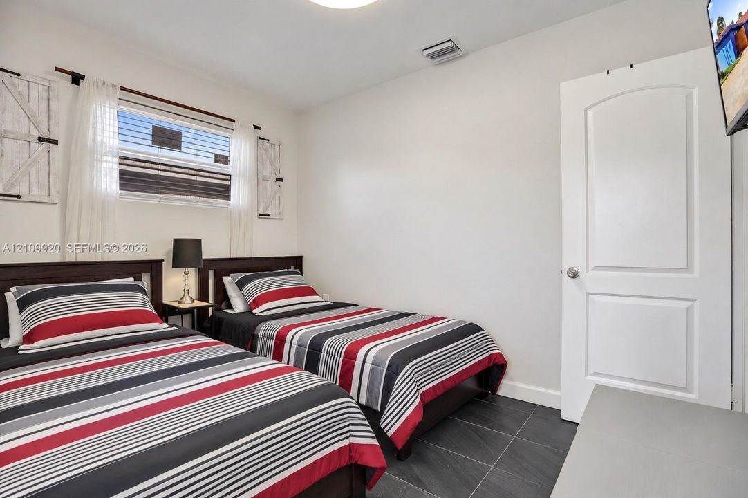 Residence 1753 (Right Side) – Bedroom 4 closet to the outdoor pool area and can be used as an office/flex space.