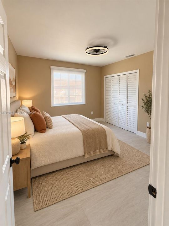 Neutral-toned bedroom featuring tile flooring, a multi-pane window, louvered bi-fold closet doors, and a modern circular flush-mount ceiling fan with integrated lighting