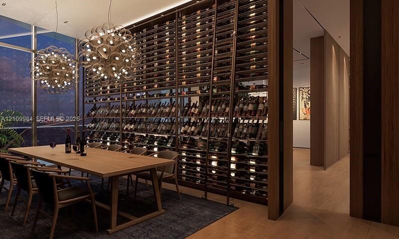 Floor-to-ceiling custom wine storage racking, wood-finish flooring, and dual spherical pendant light fixtures