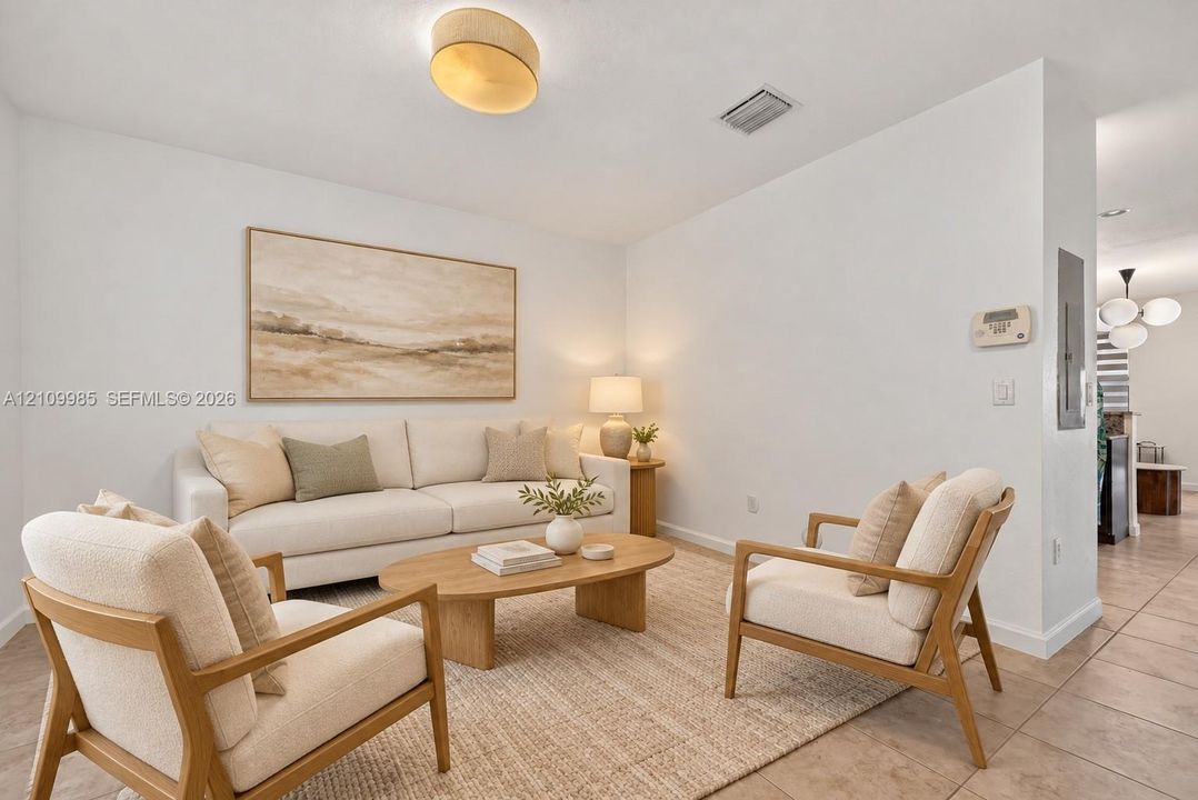Neutral interior featuring tile flooring, smooth wall finishes, and a drum-style ceiling light fixture
