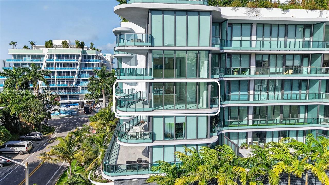 High-rise exterior featuring floor-to-ceiling glass windows