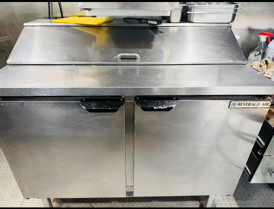 Beverage-Air dual-door stainless steel commercial refrigerator with an integrated refrigerated prep station and top-mounted hinged cover