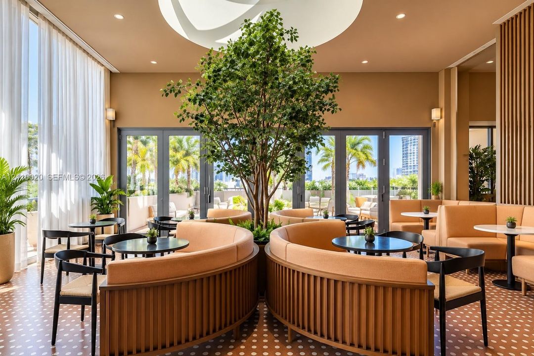 Lounge area featuring a central living tree, recessed ceiling lighting, patterned tile flooring, wood-slat wall paneling, and floor-to-ceiling glass doors