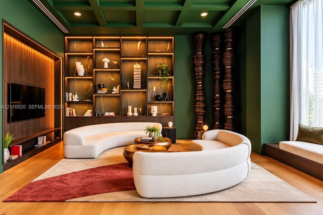 Coffered ceiling with integrated recessed lighting, expansive built-in floor-to-ceiling shelving with accent illumination, wood-finish flooring, and recessed display niche with integrated vertical lighting