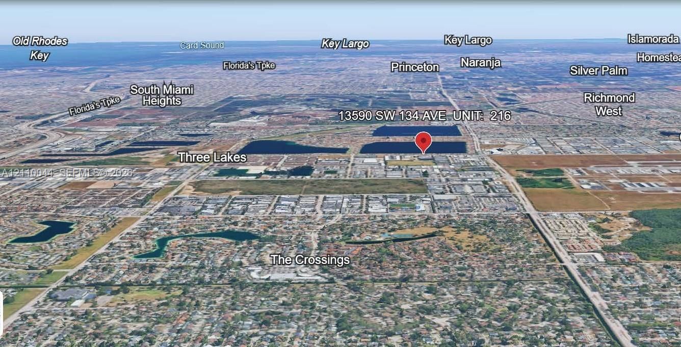 Aerial perspective highlighting the property location within the Three Lakes area, featuring proximity to regional thoroughfares and established residential districts