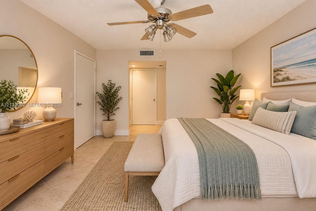 Neutral-toned interior featuring ceramic tile flooring, a central multi-blade ceiling fan with integrated lighting, and smooth-finish walls