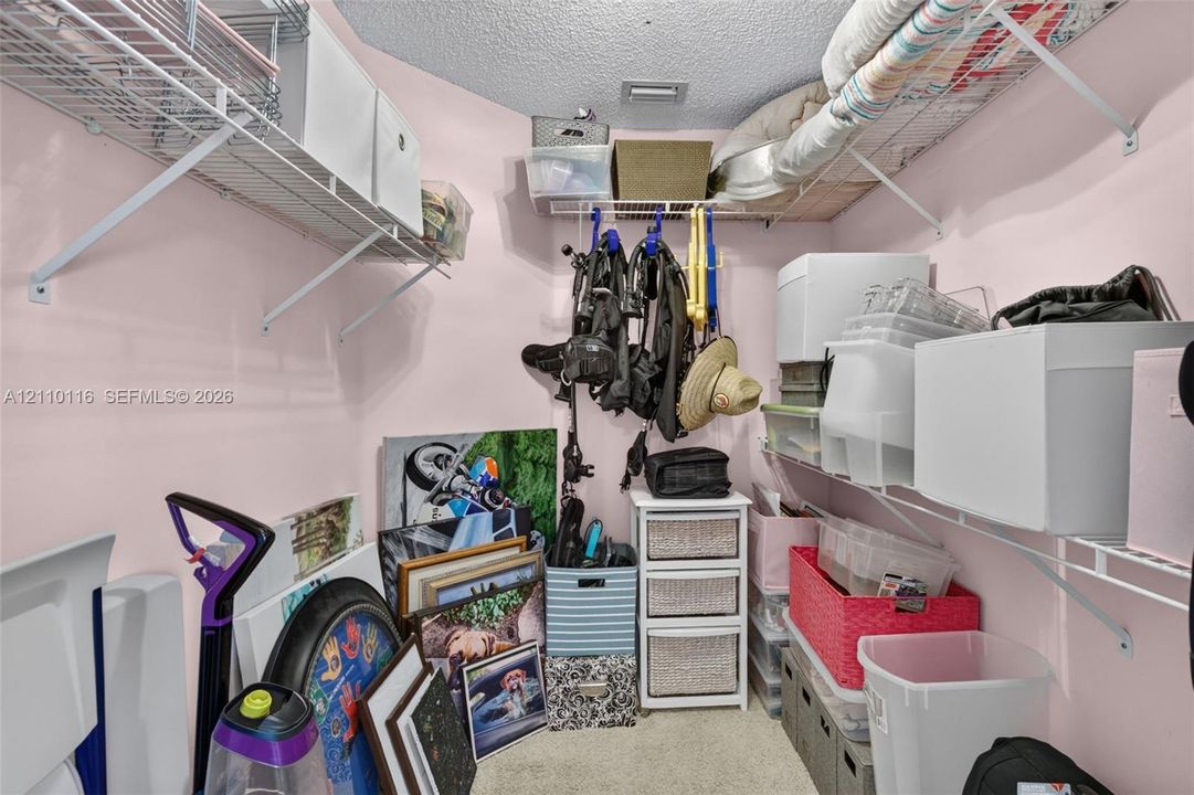 Storage space featuring wall-mounted wire shelving units