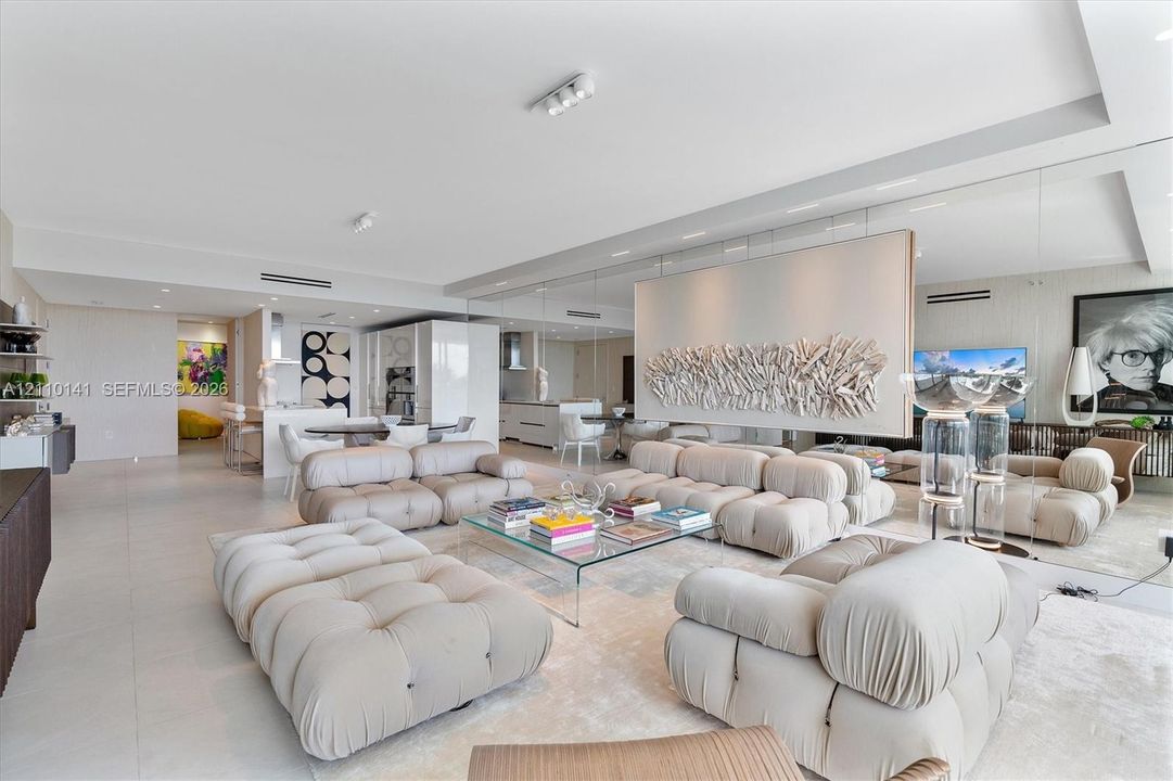 Open-concept interior wall-to-wall mirrored back wall