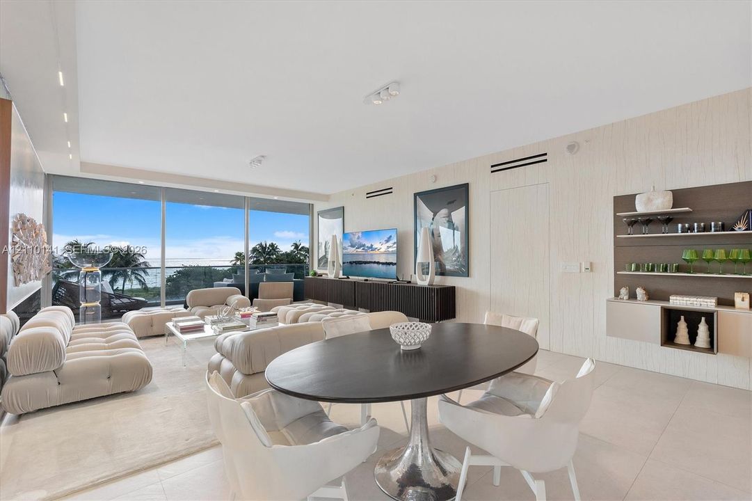 Open-concept living space. custom built ins