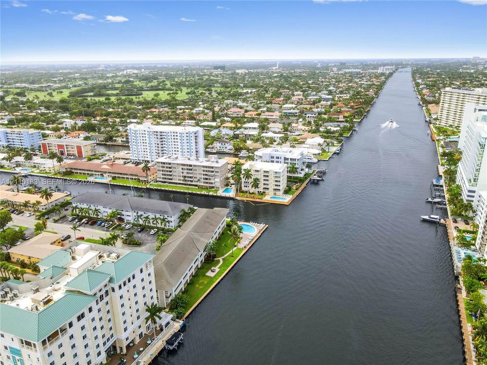 Waterfront property featuring extensive canal frontage, deep-water access, and tropical landscaping