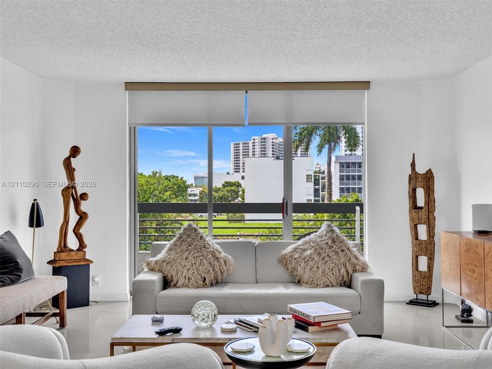 Spacious Living Area with Pool and Intracoastal Views and Updated Flooring. Floor to ceiling windows