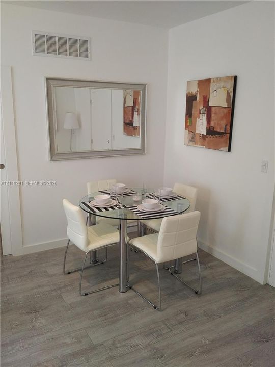 Neutral wall paint and wood-finish flooring