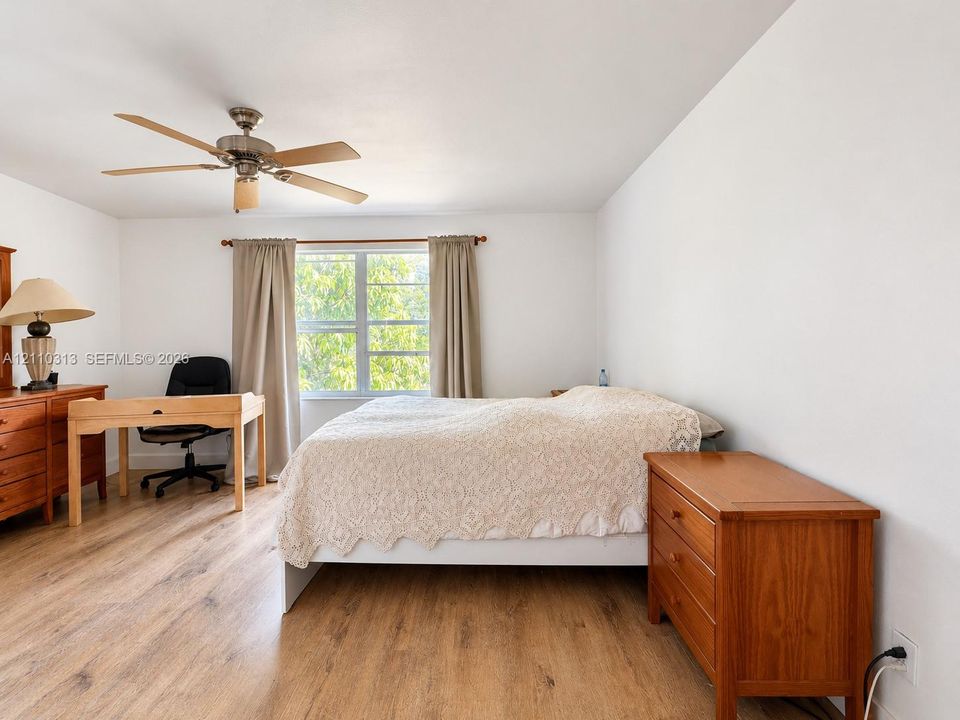 Wood-finish flooring, multi-pane window, and integrated ceiling fan