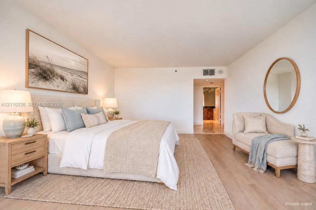 Light-filled interior featuring wide-plank wood-finish flooring and smooth finish walls