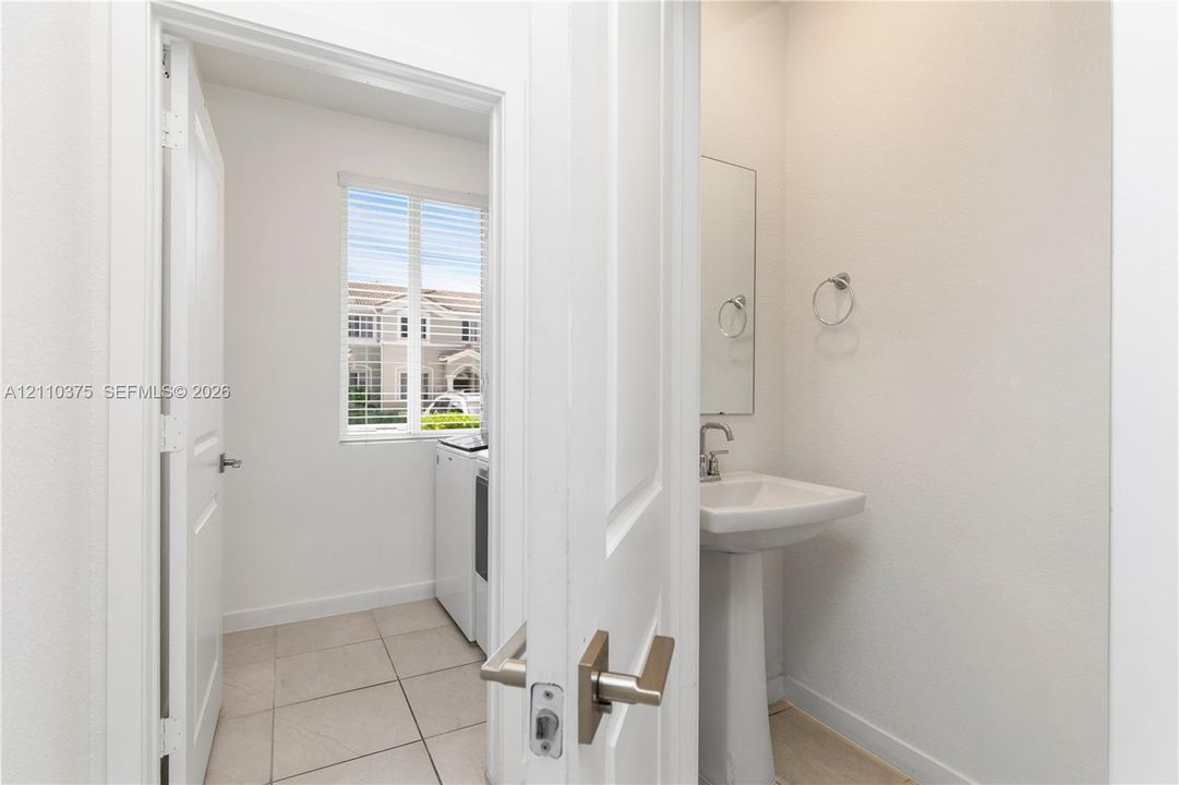 1st Floor Entrance to Half bathroom and Laundry Room
