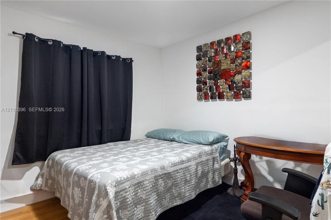 Neutral wall color and wood-finish flooring