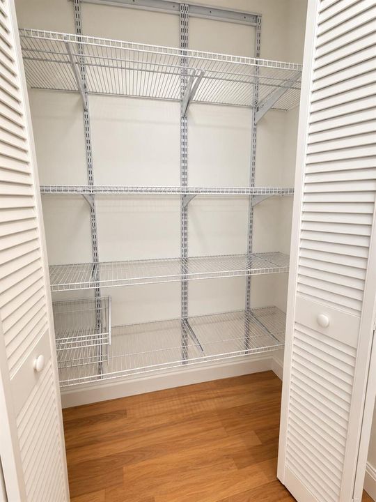 Empty White Wire-Shelved Closet