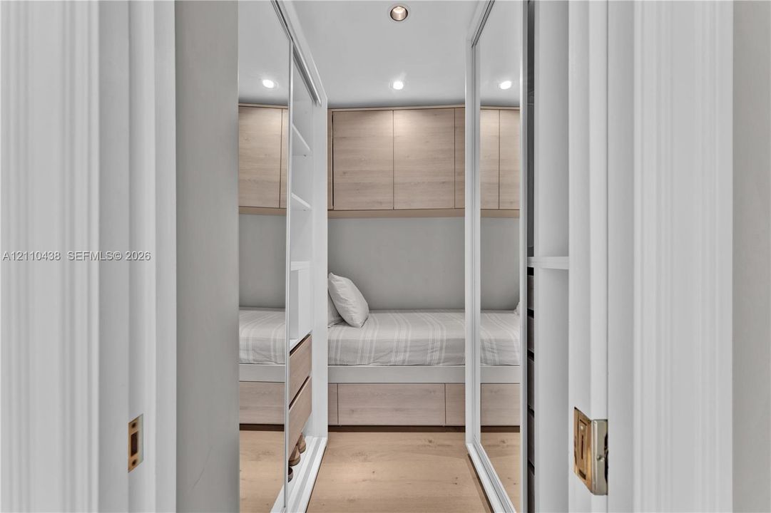2nd bedroom closet with small bed