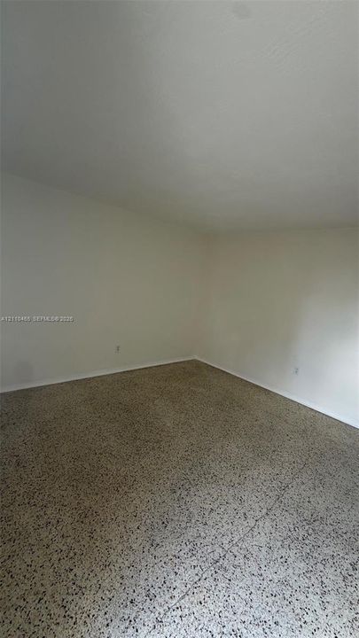 Interior space featuring terrazzo flooring and neutral wall finishes