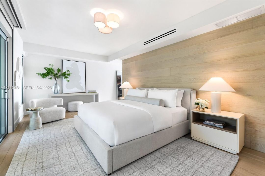 Wood-finish wall paneling, light wood-finish flooring, recessed ceiling lighting, multi-bulb flush-mount fixture, and floor-to-ceiling glass door