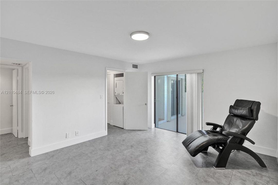 Primary bedroom large enough for an office or relaxing on a chair