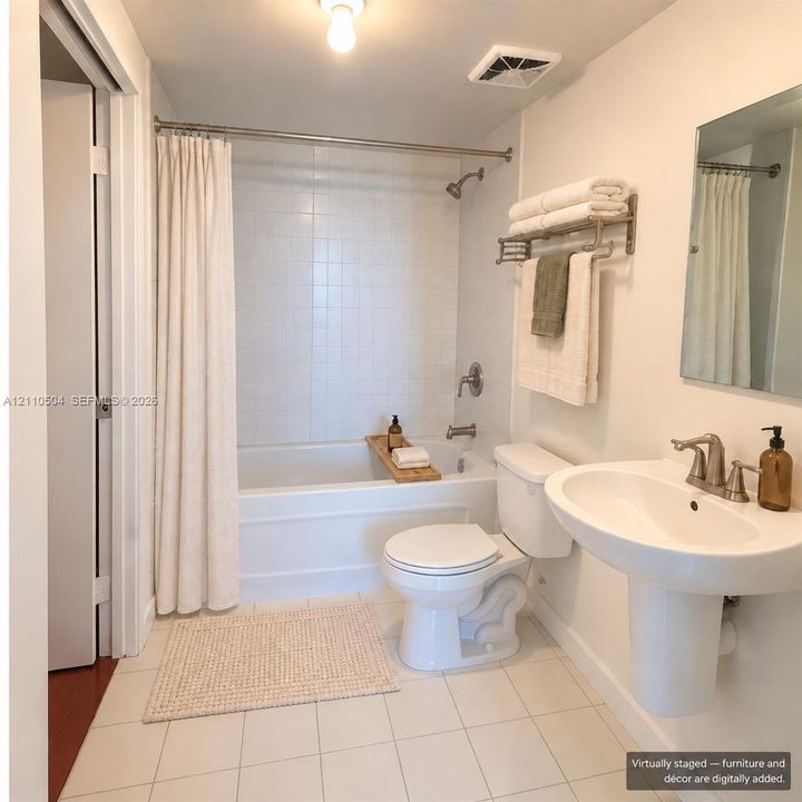 VIRTUAL STAGING -Bathroom featuring a white pedestal sink with a metallic faucet, a bathtub with full-height white tile surround, a built-in towel rack, and ceramic tile flooring