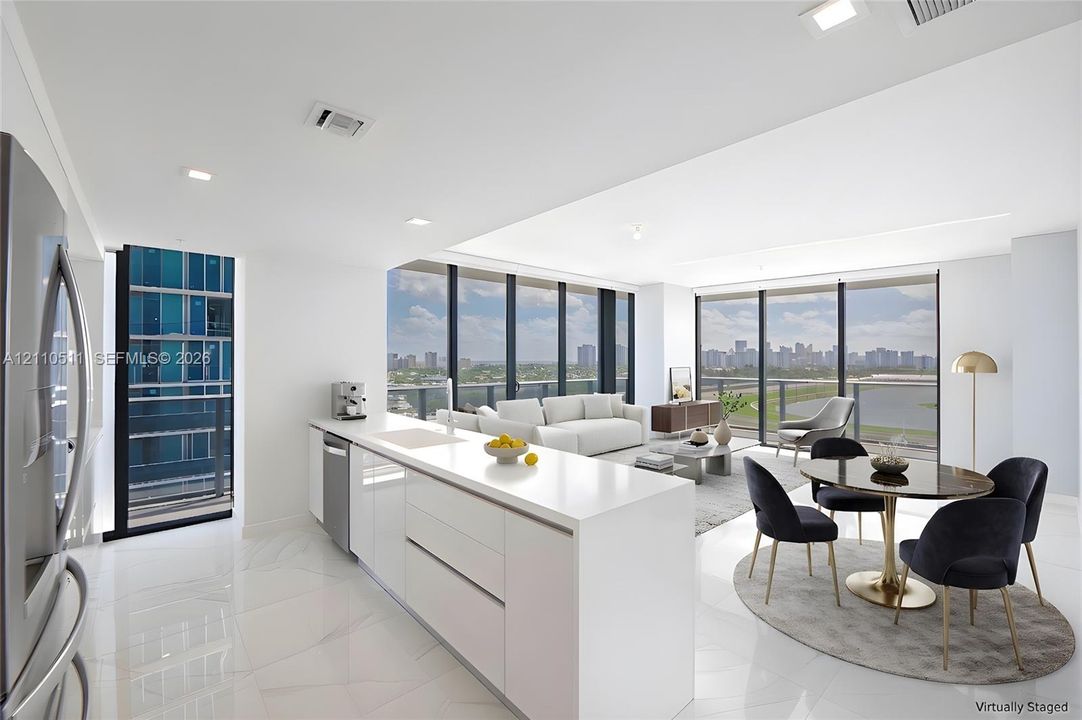 Modern kitchen featuring sleek white cabinetry, a spacious solid-surface island, floor-to-ceiling windows, and polished stone-finish flooring