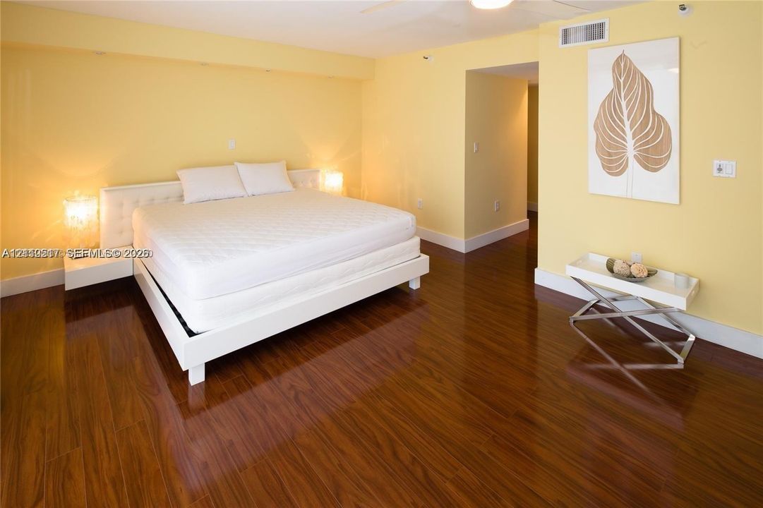 Polished wood-finish flooring complemented by recessed ceiling lighting