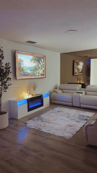 Wood-finish flooring and floor-to-ceiling mirror wall paneling