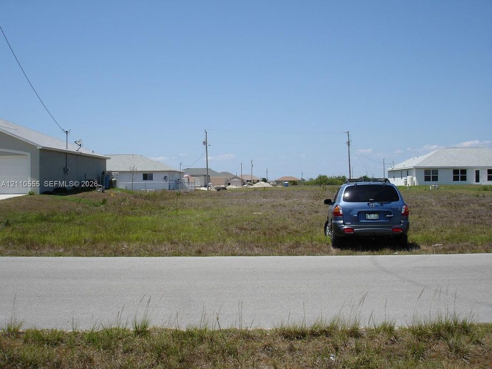 Vacant residential lot featuring paved street frontage and cleared, level terrain