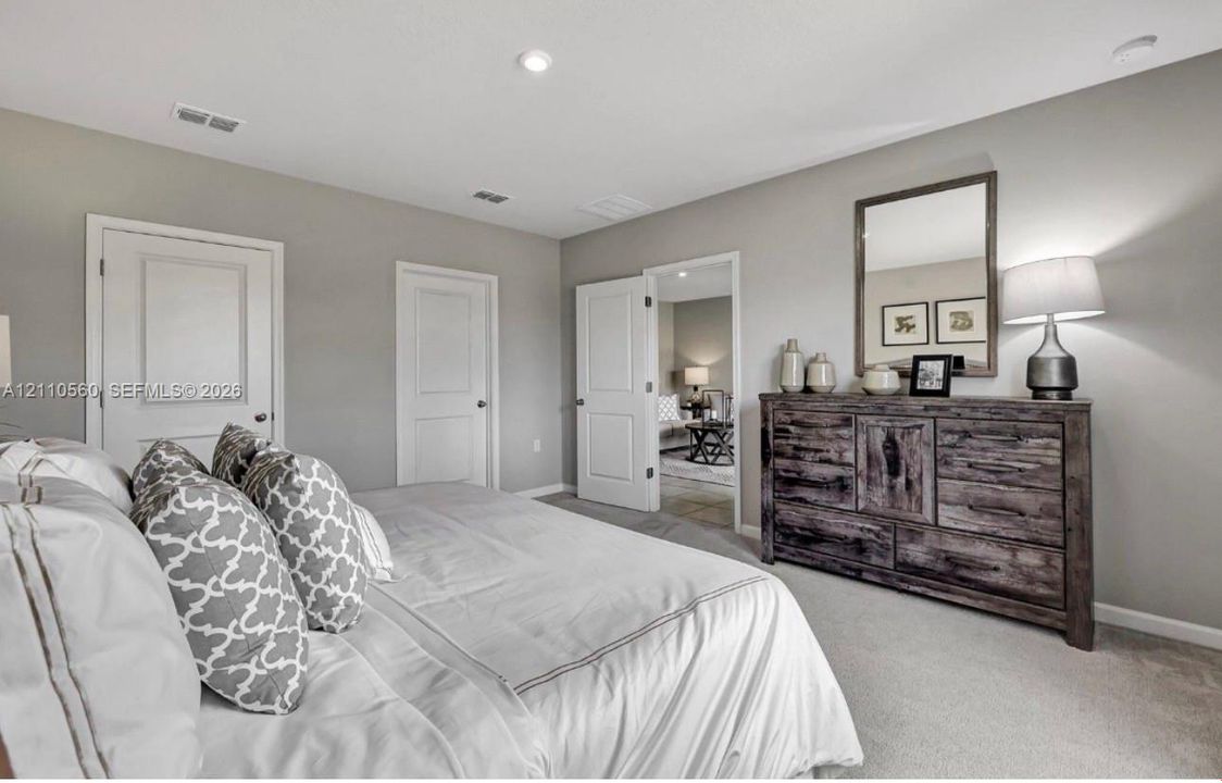 Neutral-toned interior featuring recessed lighting, carpeted flooring, and multi-panel interior doors