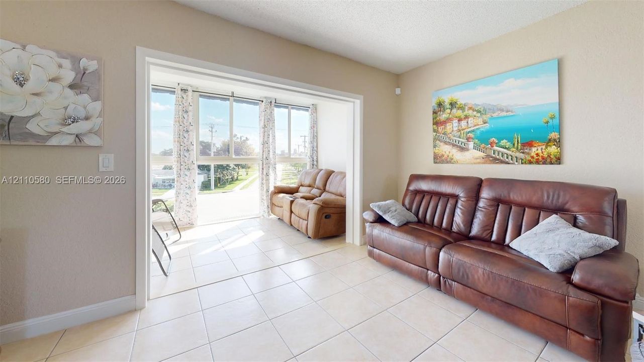 Ceramic tile flooring, neutral wall finish, and floor-to-ceiling windows