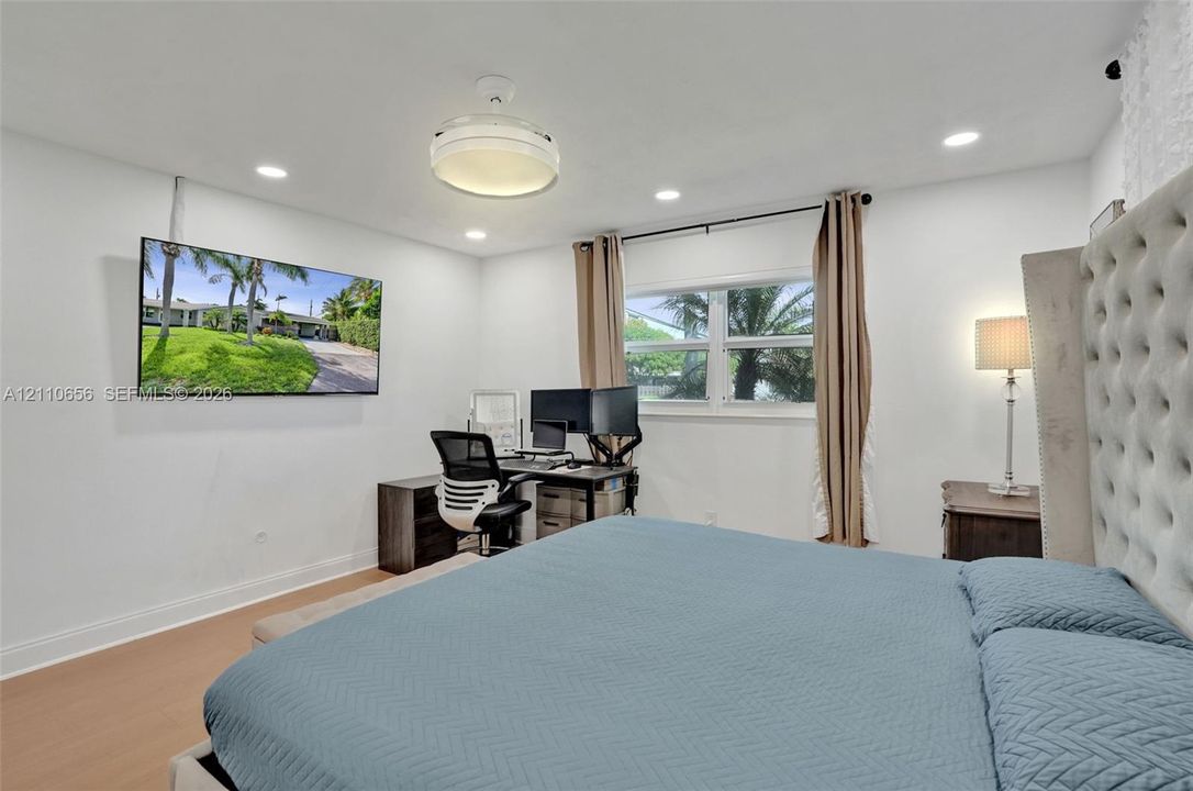 Wood-finish flooring, recessed lighting, ceiling-mounted light fixture, and horizontal sliding window