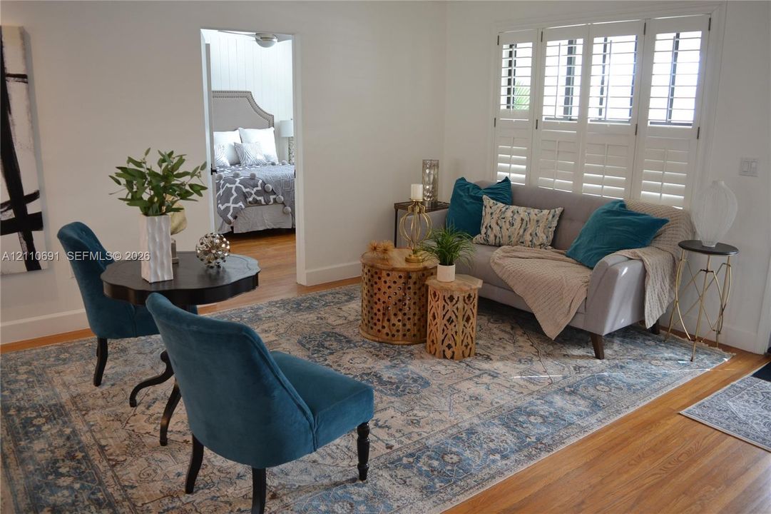 Hardwood flooring and multi-panel plantation shutters