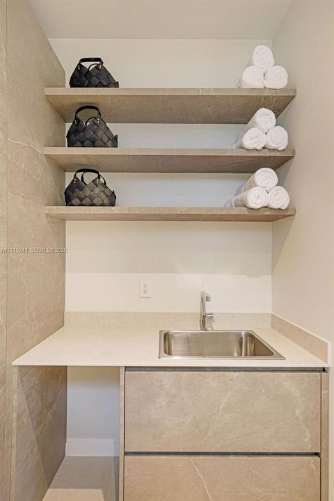 laundry room with built in cabinetry