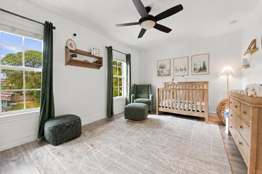 Clean Nursery Wall Beneath Wooden Shelf