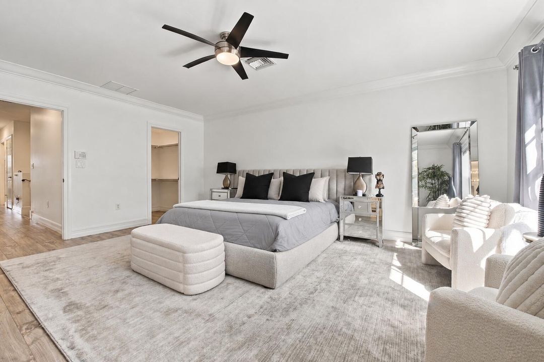 Tidy bedroom with an empty closet