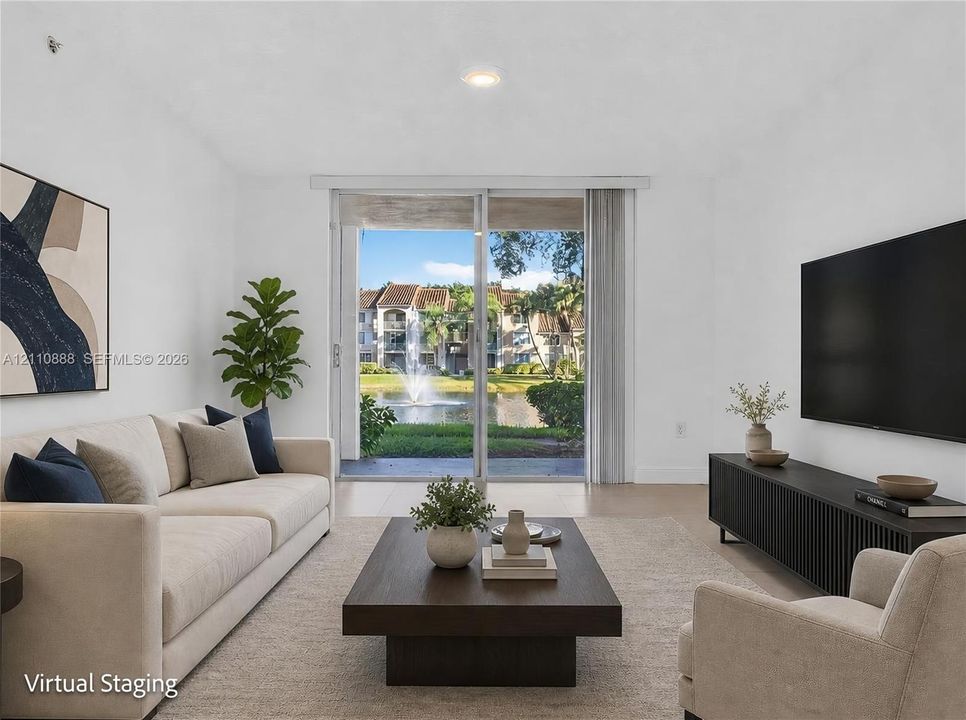 Living room featuring sliding glass doors and neutral tile flooring
