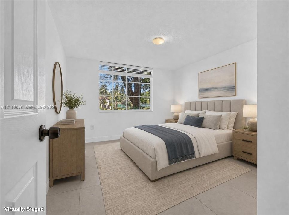 Large multi-pane window with exterior scenery, neutral tile flooring, and flush-mount ceiling light