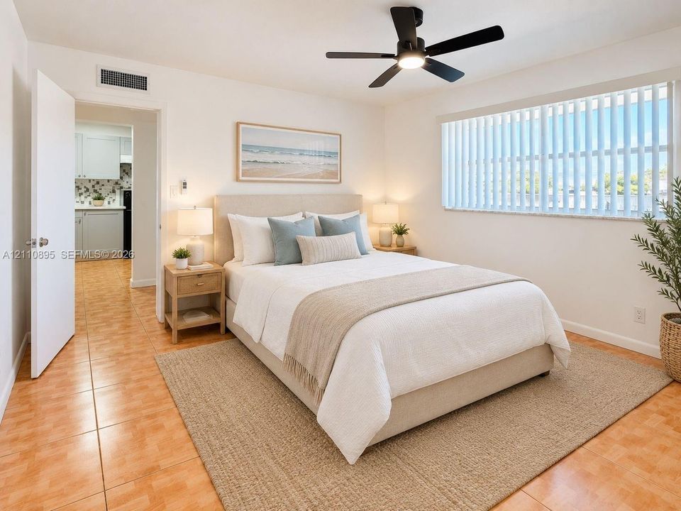 Room featuring tile flooring, neutral walls, vertical window blinds, and a matte black ceiling fan with integrated lighting
