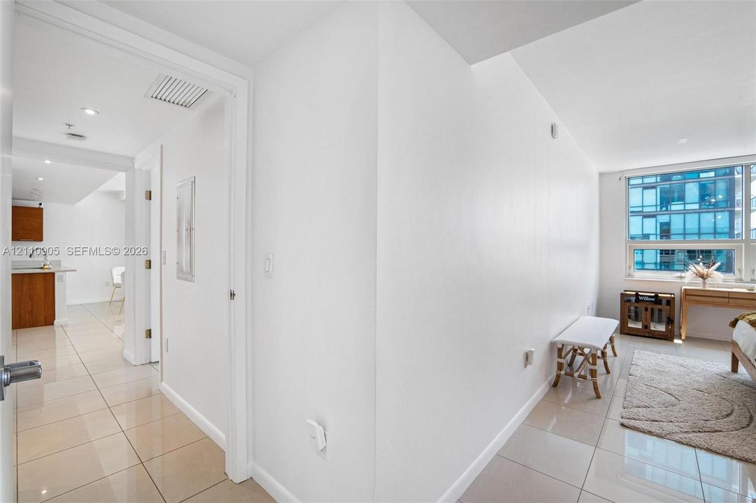 Interior space featuring large-format tile flooring, recessed lighting, and expansive windows