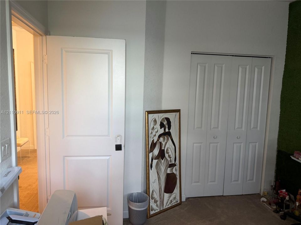 Interior space featuring two-panel interior doors and a bifold closet door