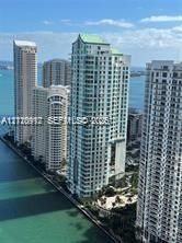 High-rise urban residential towers with waterfront positioning and balcony architectural detailing