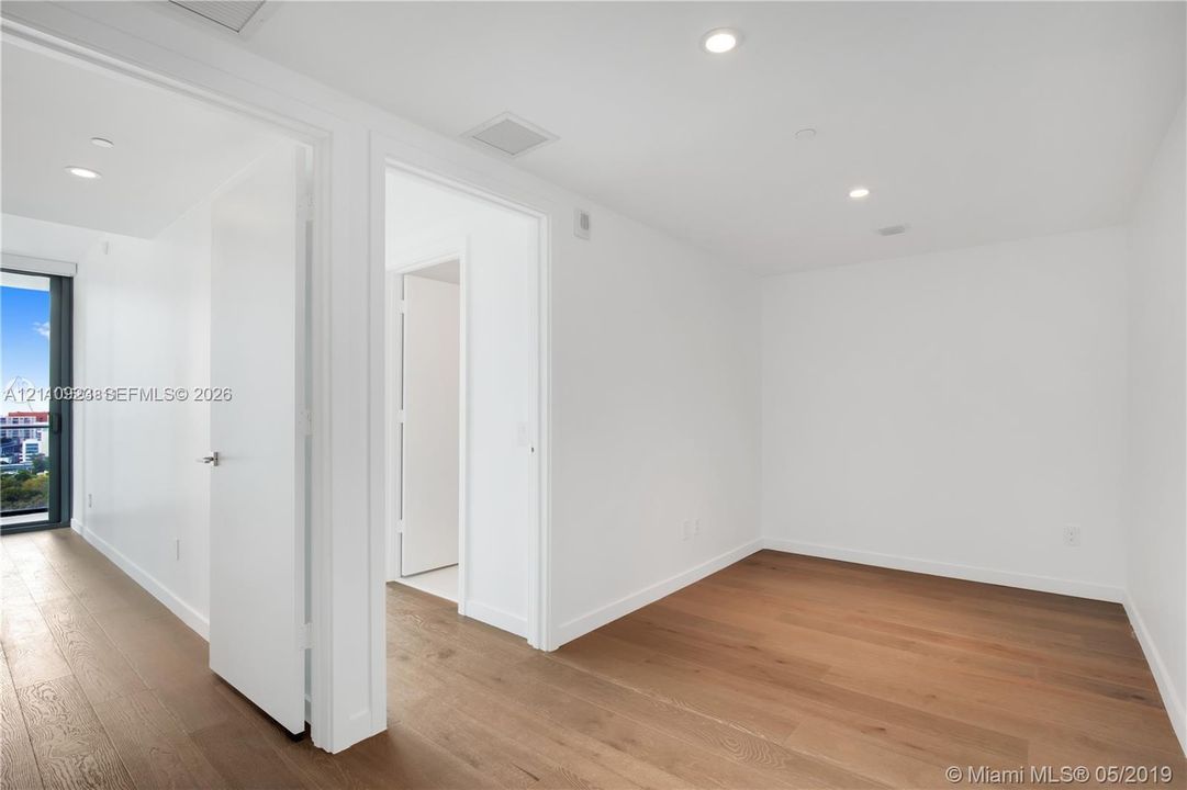 Interior space featuring wood-finish flooring, recessed lighting, den space connected to 2nd & 3rd BR. A separate door encloses these rooms ideal for children and play room