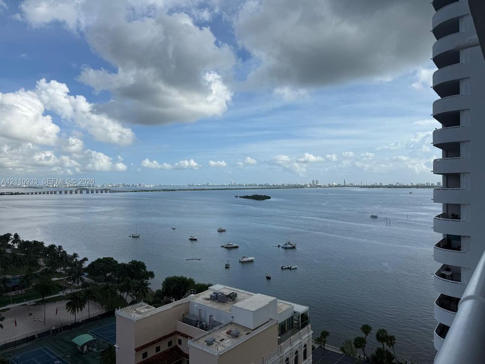 High-rise balcony featuring extensive bay and coastal skyline scenery