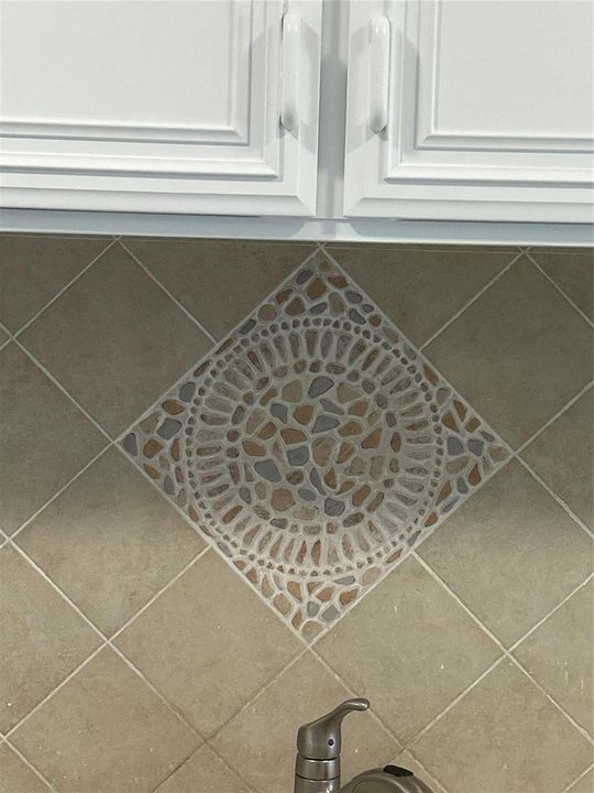 Custom backsplash over kitchen sinks.