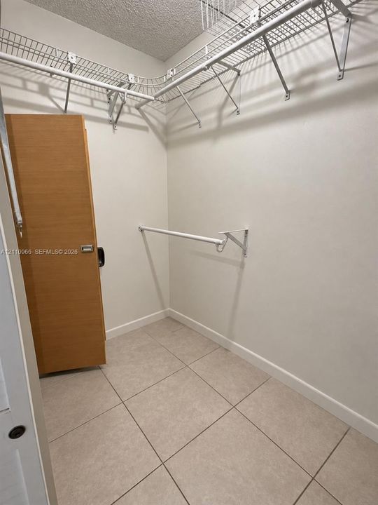 Walk-in closet featuring large-format