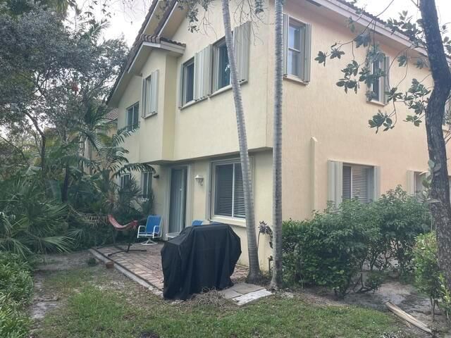 Exterior w/ Accordian Shutters