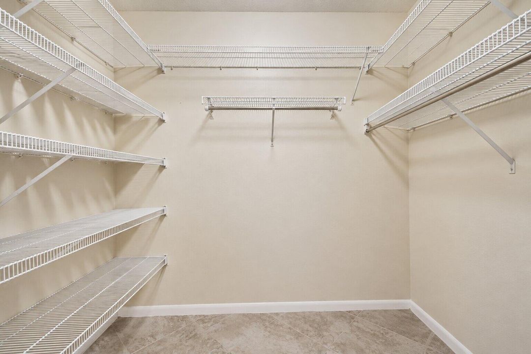 14 - Primary Bedroom Closet VIRTUALLY RE
