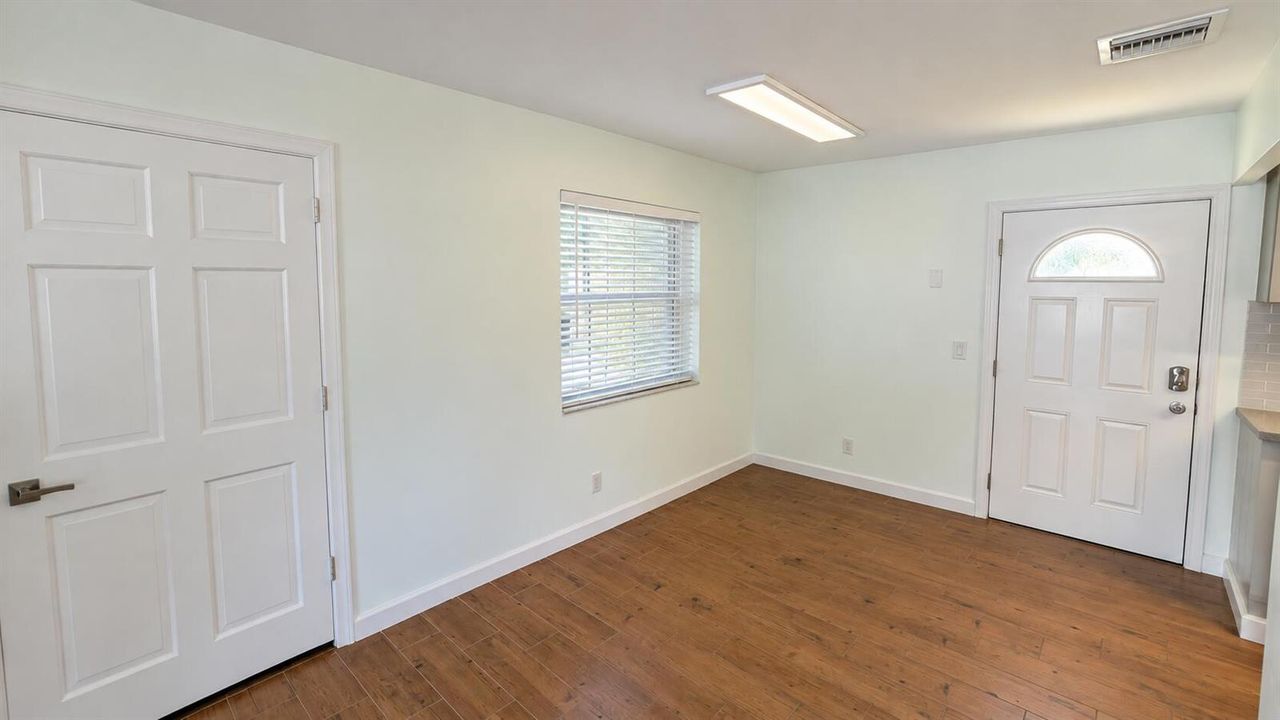 Bright Empty Room with Doors and Window